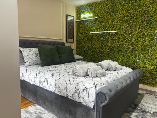 a bedroom with a bed with towels on it at Stylish 1-Bed Apartment in Chester with Parking & Full Kitchen in Chester