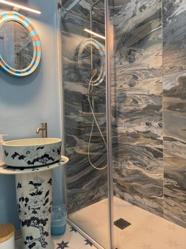 a bathroom with a shower and a sink at Villa Dorée in Milan