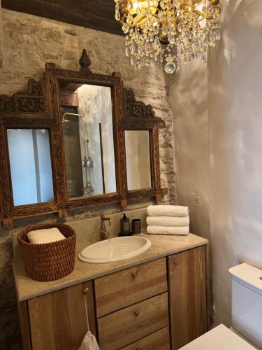 a bathroom with a sink and a mirror at Old town gem in Tallinn