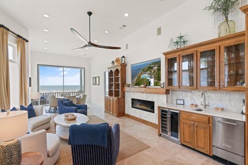 a kitchen and living room with a couch and a table at Sea-Esta - 1136 Postell in East End