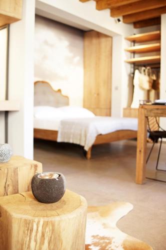 a bedroom with a bed and a table with a bowl at History Hvar 1529 in Hvar