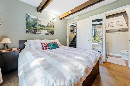 a bedroom with a large bed and a staircase at Chief Peak in Fish Camp