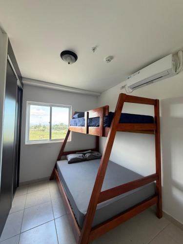a bunk bed room with two bunk beds in it at An apartment with ocean views in Chiriquí