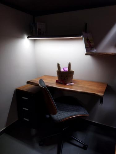 a desk with a chair in a room at The swanky studio in Anatolí