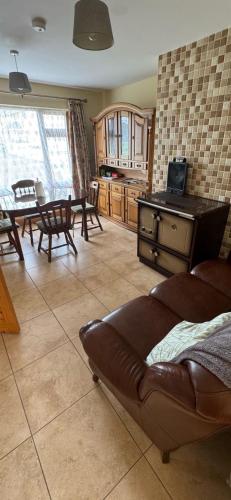 a living room with a couch and a table at Kathleen’s Haven in Causeway