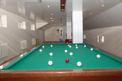 a pool table with balls on top of it at NR Rest House in Tsaghkadzor