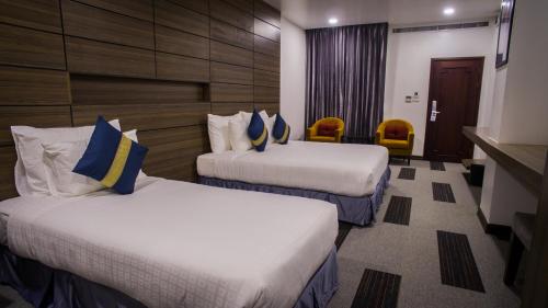 Katil atau katil-katil dalam bilik di Family Boutique Hotel