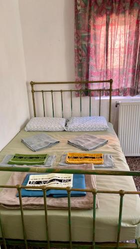 a bed in a room with a bed frame and a window at Traditional Rooms Elena in Astirákion