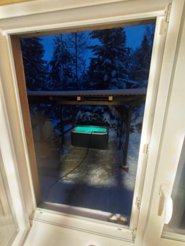 a view from the window of a room with a table at Chata pod zubačkou in Tatranska Strba