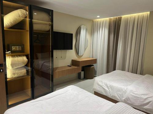 a hotel room with a bed and a mirror at Sun gate house in Cairo