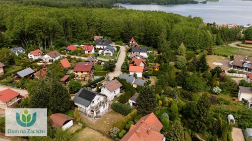 an aerial view of a small town with houses at Dom na Zaciszu Charzykowy in Charzykowy