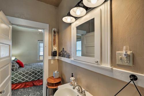 a bathroom with a sink and a mirror and a bed at Walkable Group Getaway in Bisbee: 4-Unit Bundle! in Bisbee