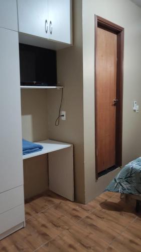 a room with a white desk and a door at Ada 311b in Ciudad del Este