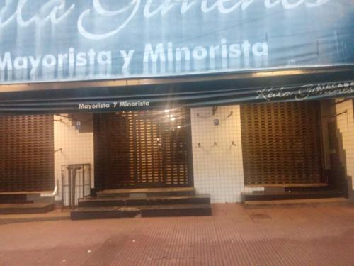 a building with a sign on the front of it at Ada 311b in Ciudad del Este