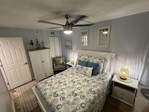 a bedroom with a bed and a ceiling fan at Ocean Front Condo-Beach Front Pool Hottub Elevator in Myrtle Beach