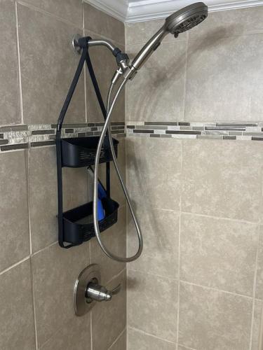 a shower in a bathroom with a shower head at Ocean Front Condo-Beach Front Pool Hottub Elevator in Myrtle Beach