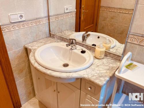 a bathroom with a sink and a bath tub at San Gregorio 2 in Soria