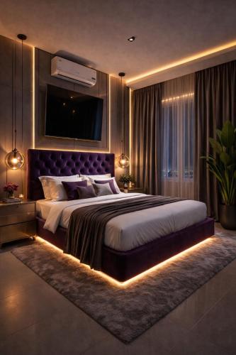 a bedroom with a large bed with a led lighting at Morbex Inn Hotel Islamabad in Islamabad