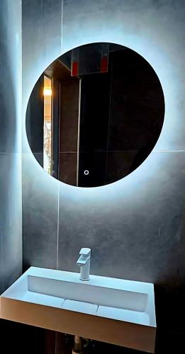 a bathroom with a sink and a mirror at Kadenca in Umag
