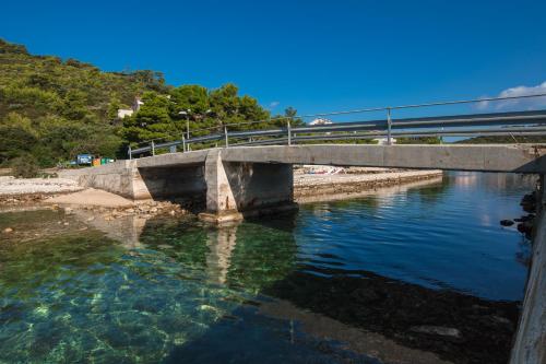 a bridge over a body of water at Apartments Bruna in Lastovo