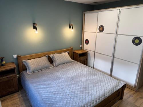 a bedroom with a bed with two pillows at Lielupes Apartments Jurmala in Jūrmala
