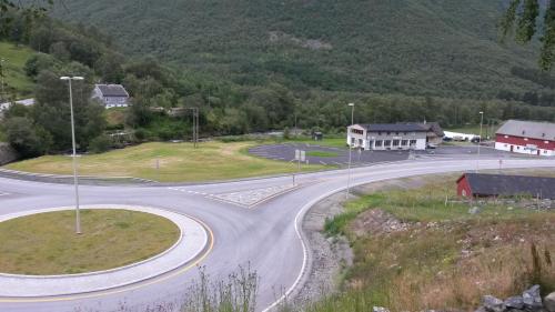 an winding road in a village in the mountains at HI Borlaug Vandrerhjem in Borgund
