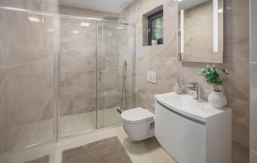 a bathroom with a shower and a toilet and a sink at Villa Fiore di san Antonio in Rovinj