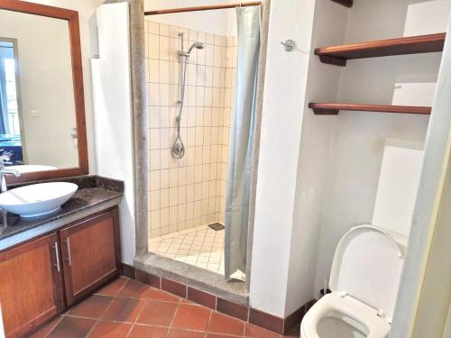 a bathroom with a shower and a toilet at Port Chambly Waterside Villa in Terre Rouge