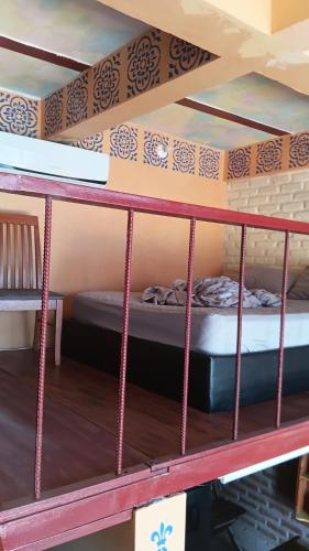 two bunk beds in a room with a bed at Buena Vista in Taganga