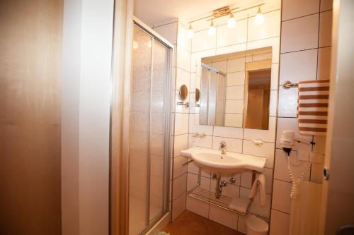 a bathroom with a sink and a mirror at Piz Arina in Ischgl