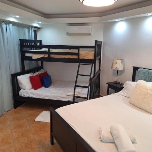 a room with two bunk beds and a bed at Urbanutopia Apartment A109 in Villas del Mar