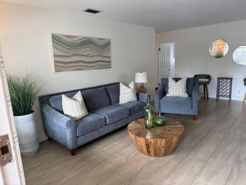 a living room with a couch and a table at Cozy 3Bdr home in the heart of Tampa in Tampa
