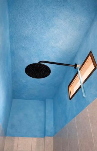 a room with a blue ceiling with a light on it at Oceanfront, AC and Parking, La Punta in Paso Hondo