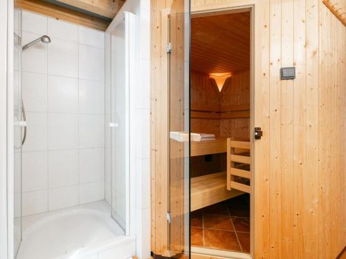 a bathroom with a shower and a bath tub at Bergsehnsucht in Hippach