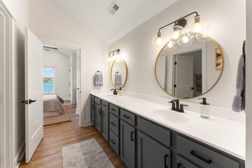a bathroom with a sink and a mirror at Bay Dreaming in Montross