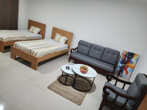 a living room with a couch and a table at Soares Stay in Tarrafal