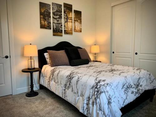 a bedroom with a large bed with two lamps at Parker Strip Vacation Villa in Parker