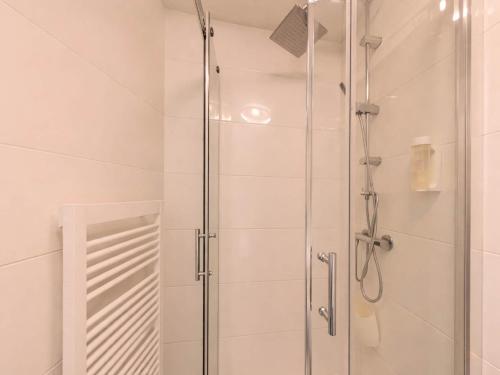 a shower with a glass door in a bathroom at Studio Martina mit Pool und Sauna in Freyung