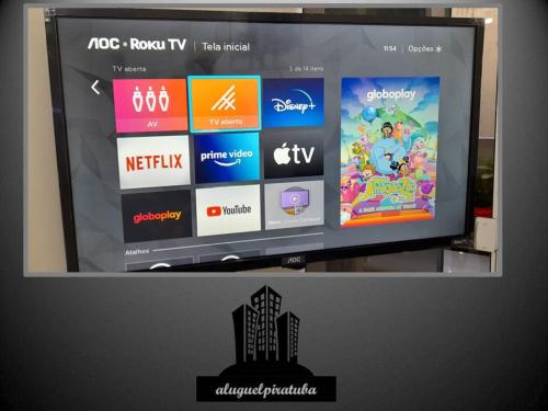 a television screen with a video game on it at Aluguel Piratuba, apto 104 Dambros in Piratuba