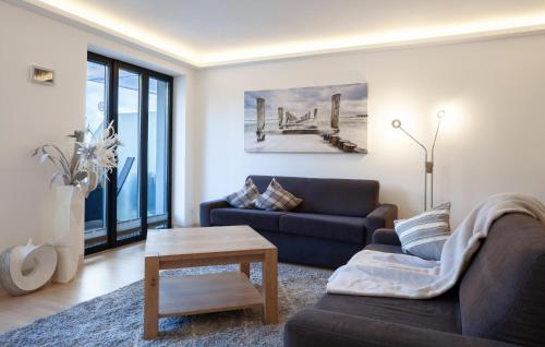 a living room with a couch and a table at Junior in Binz