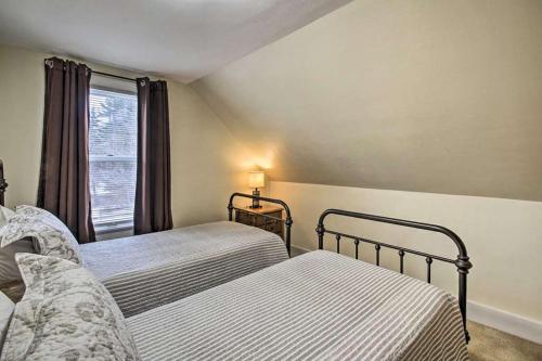 a bedroom with two beds and a window at Relaxing Getaway Near Everything in Kennebunk