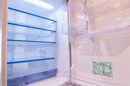 an empty refrigerator with its door open at Villa Blanca Yoichi in Yoichi