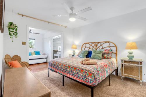 a bedroom with a bed with a dog laying on it at Bee Happy at the Lake in Canyon Lake