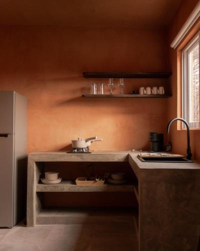 a kitchen with a counter and a sink in it at Casa Maja Villas Chapala in Chapala
