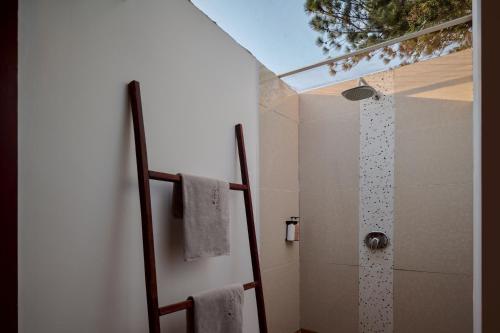 a bathroom with a shower with a shower curtain at Pidoma Resort by EHM in Senmonorom
