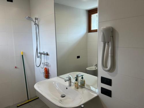 a bathroom with a sink and a shower at Mergozzo Beach in Mergozzo