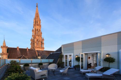 a building with a clock tower in the background at Rocco Forte Hotel Amigo in Brussels