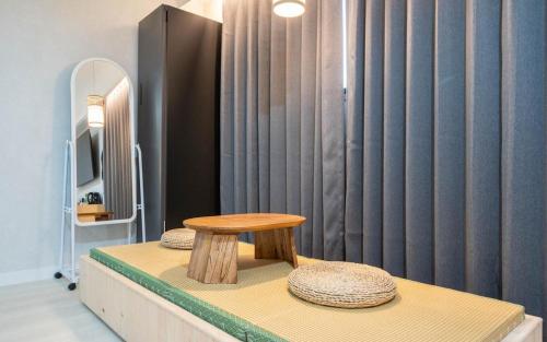 a table sitting on top of a counter in a room at H Avenue Hotel Gyeryong Eomsa branch in Gyeryong