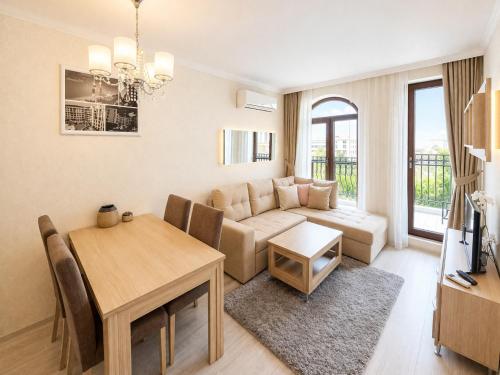 a living room with a couch and a table at Harmony 20 Sveti Vlas Private Apartment 211 in Sveti Vlas