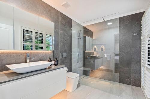 a bathroom with a sink and a shower at Ocean Outlook Retreat in River Heads